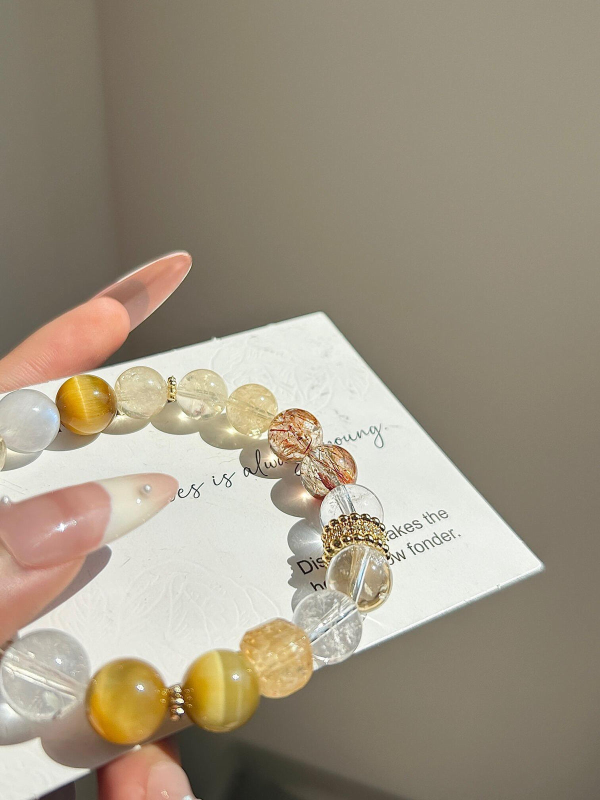 Additional view of natural Golden Tiger's Eye, Lemon Azeztulite (trade name) bracelet with 8mm beads with gemstone details