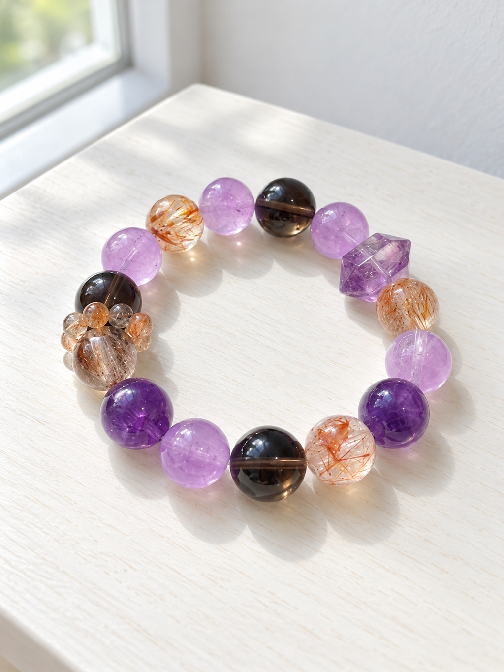 Natural amethyst, black gold Super Seven and smoky quartz bracelet with a double-terminated amethyst accent and 13mm beads