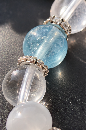 Close-up of Aquarius bracelet featuring Aquamarine, Moonstone and natural Clear Quartz details