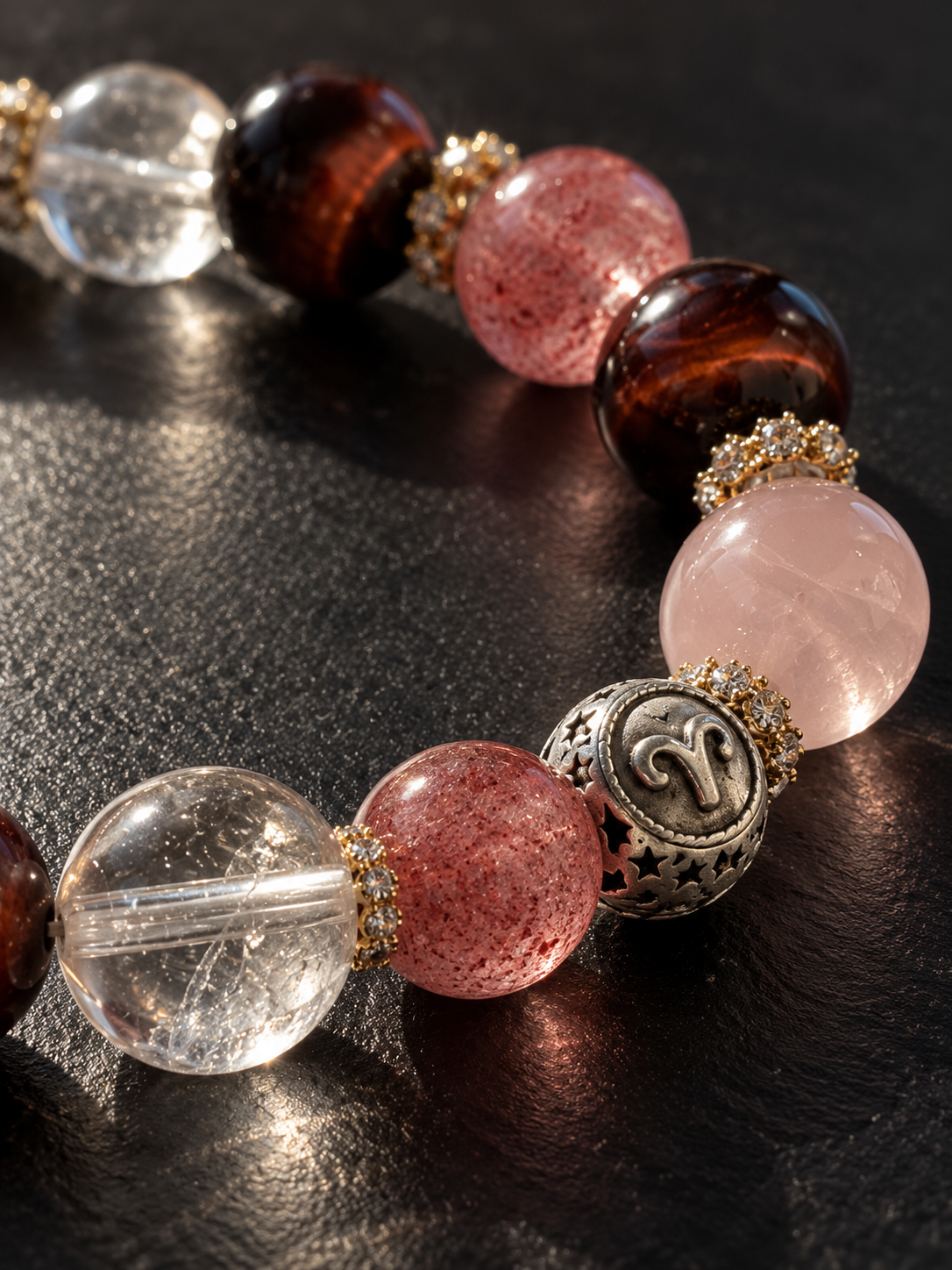 Close-up of Aries bracelet featuring Strawberry Quartz, Red Tiger’s Eye, Clear Quartz and Rose Quartz beads