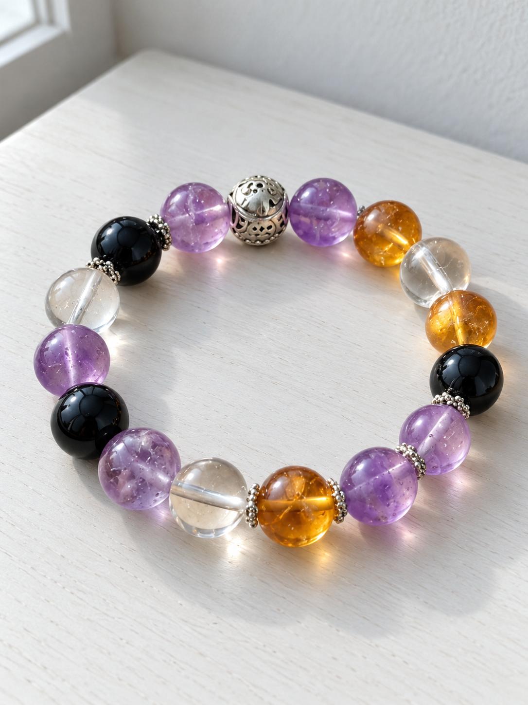 Capricorn zodiac bracelet with Amethyst, Obsidian, Golden Flower Agate, Clear Quartz and zodiac spacer