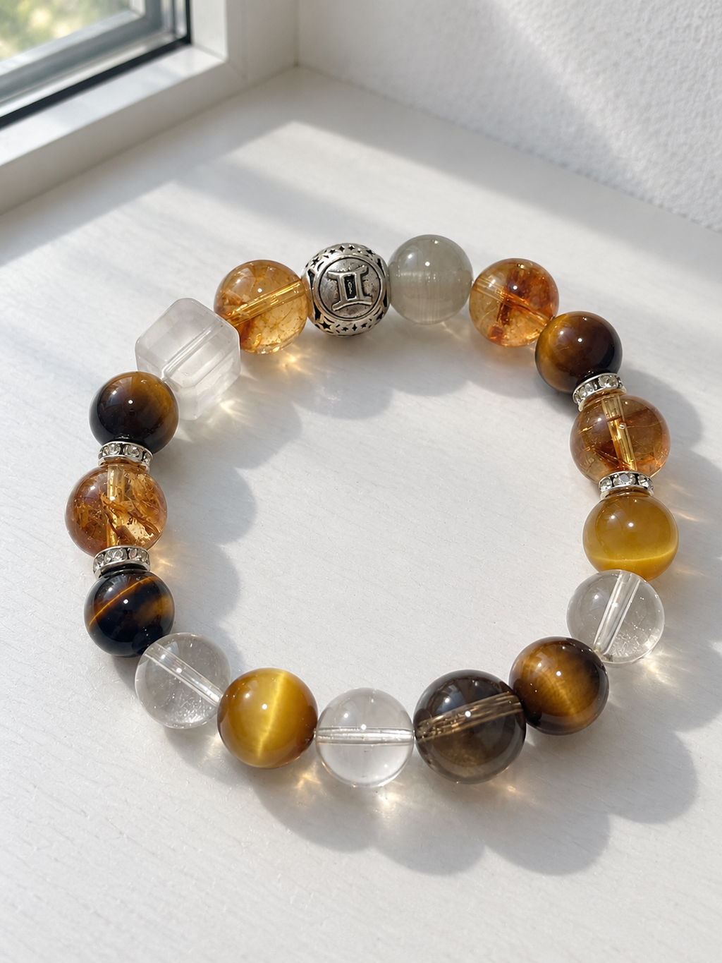 Gemini zodiac bracelet with Tiger’s Eye, Golden Flower Agate, Clear Quartz and golden-toned gemstone accents