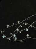 Close-up of Natural Moonstone chain necklace showing luminous gemstone drops and fine chain details