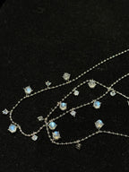 Close-up of Natural Moonstone chain necklace showing luminous gemstone drops and fine chain details