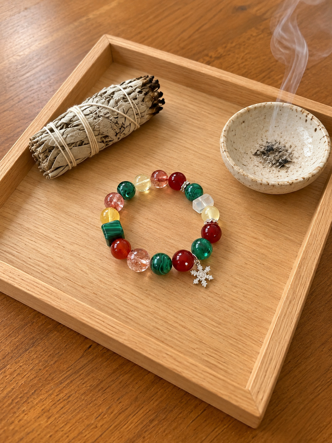 Malachite, Red Agate, Citrine and Yellow Fluorite bracelet displayed in a minimalist holiday purification ritual setting